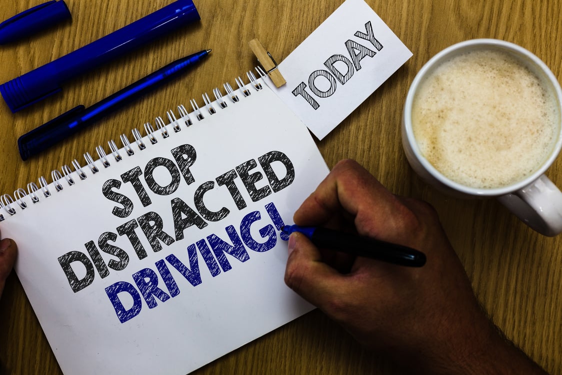 Text sign showing Stop Distracted Driving. Conceptual photo asking to be careful behind wheel drive slowly Man holding marker notebook clothespin reminder wooden table cup coffee.